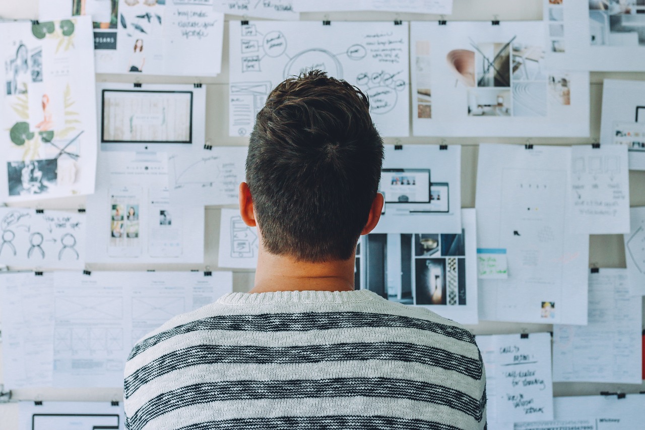 Man looking at board