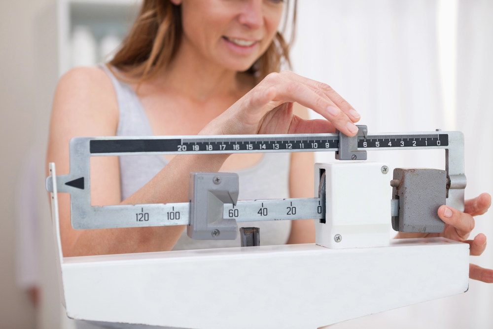 Woman checking scales
